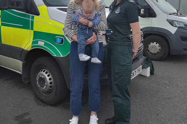 Alex Clayton and son Fraser with ambulance call handler Lorna Milward (Scottish Ambulance Service/PA)