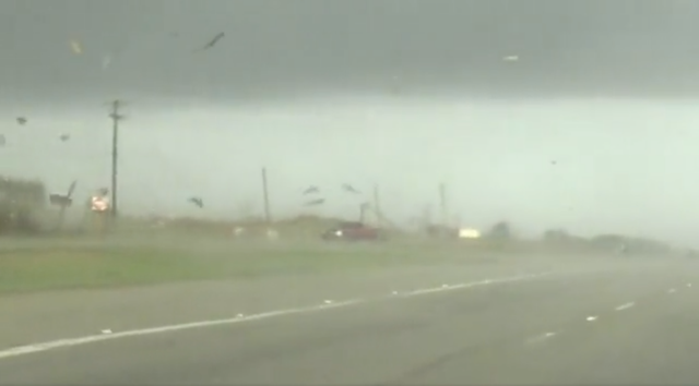 <p>A video shared on Twitter from Elgin, Texas shows a red truck get flipped by a tornado and then recovering upright to continue driving off on 22 March 2022. </p>