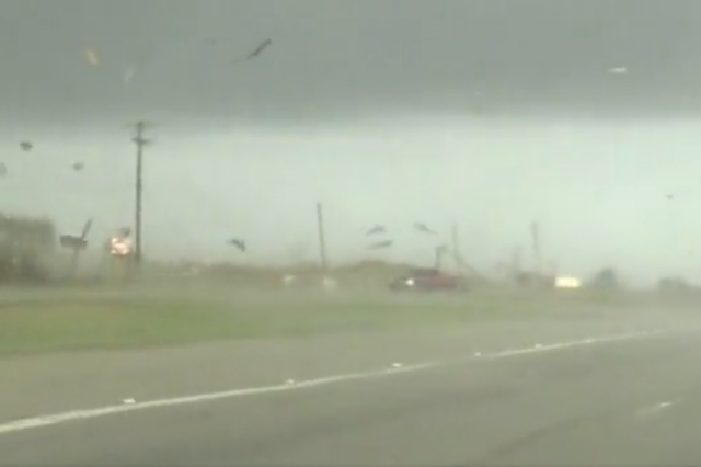 <p>A video shared on Twitter from Elgin, Texas shows a red truck get flipped by a tornado and then recovering upright to continue driving off on 22 March 2022. </p>