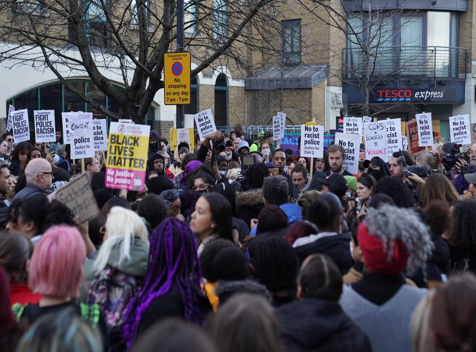 People demonstrate outside Stoke Newington police station, in London, over the treatment of a black 15-year-old schoolgirl who was strip-searched by police while on her period (Stefan Rousseau/PA)