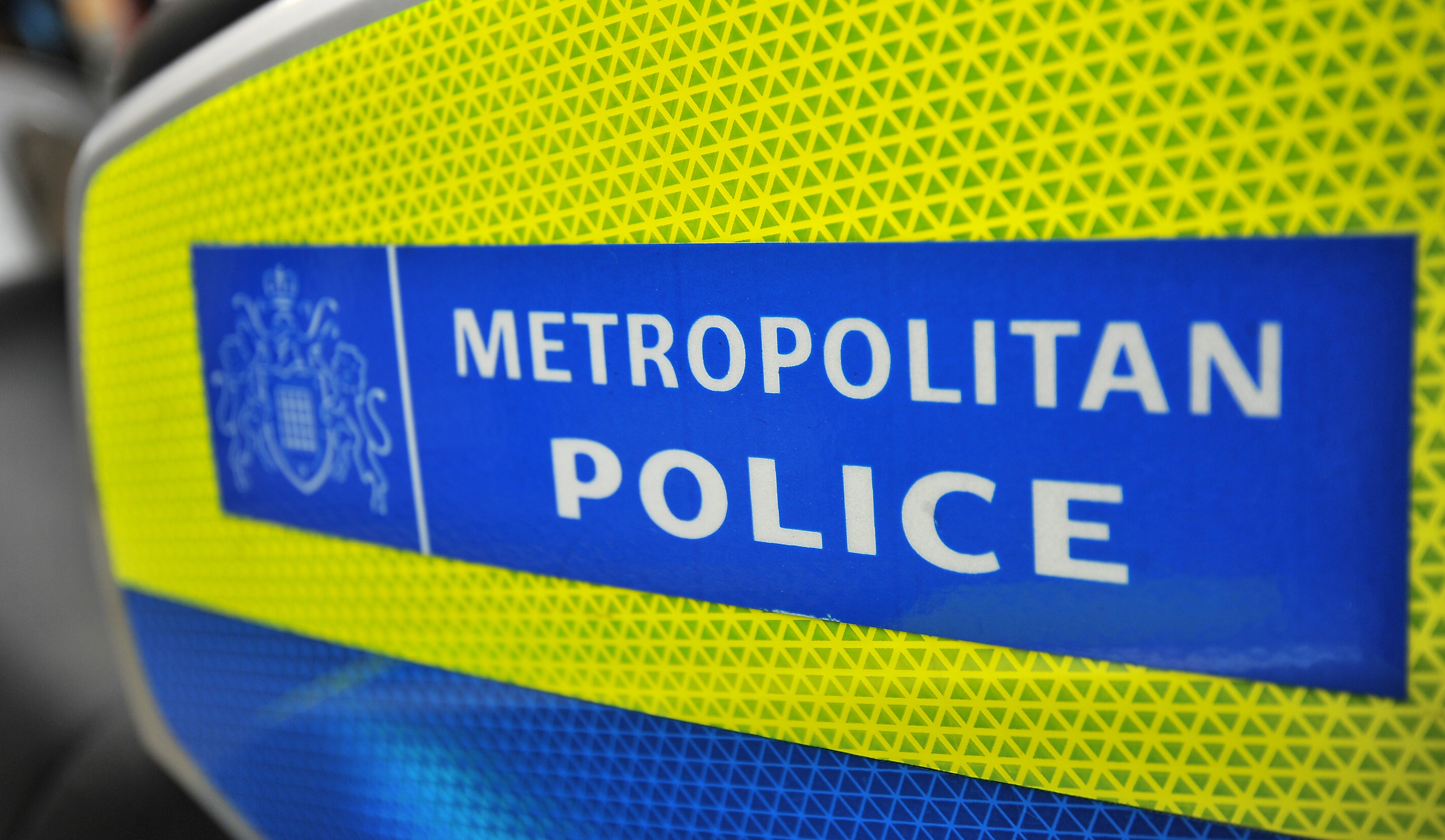 General view of a Metropolitan Police sign on the side of a BMW London Metropolitan police motorcycle (Andrew Matthews/PA)