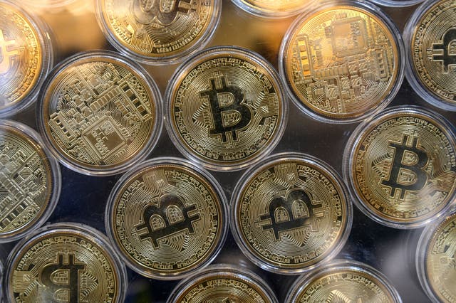 <p>File photo: Physical imitation of Bitcoins are pictured at a cryptocurrency exchange </p>