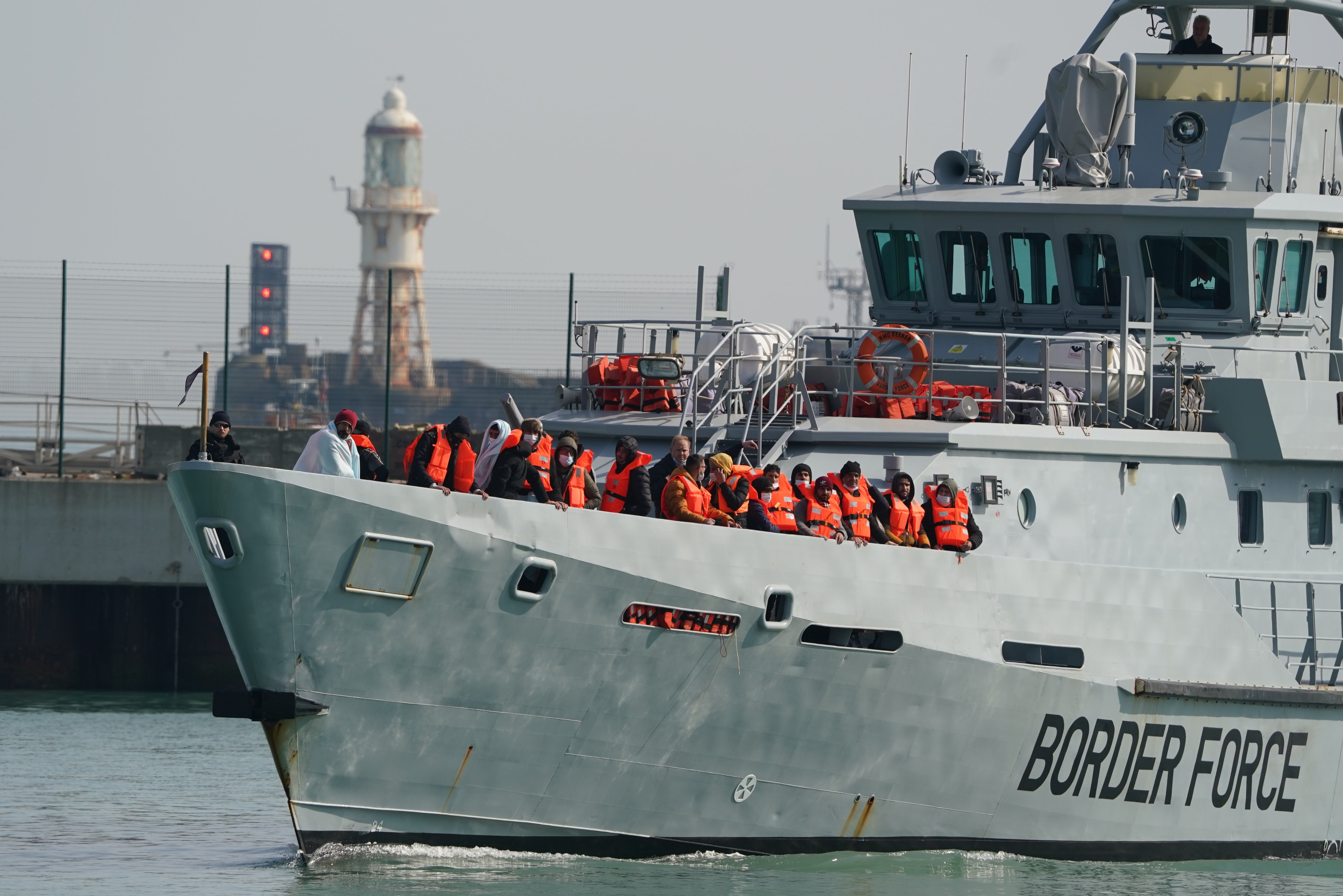 A group of people thought to be migrants are brought in to Dover, Kent, onboard a Border Force vessel following a small boat incident in the Channel last month