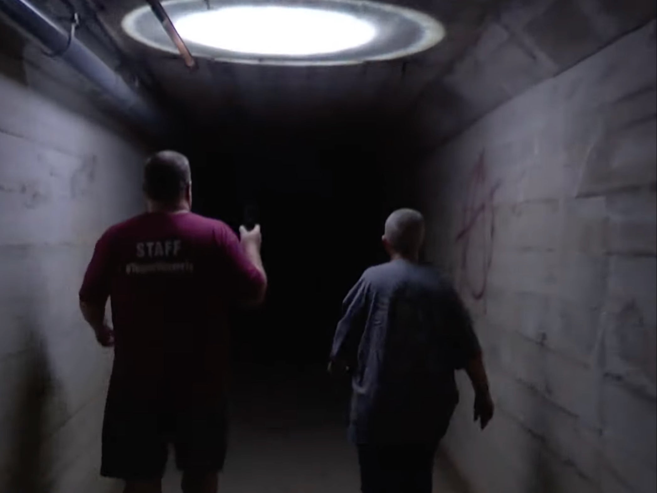 <p>Tour organisers inside the ‘dead body chute’ at Waverly Hills, outside Louisville </p>