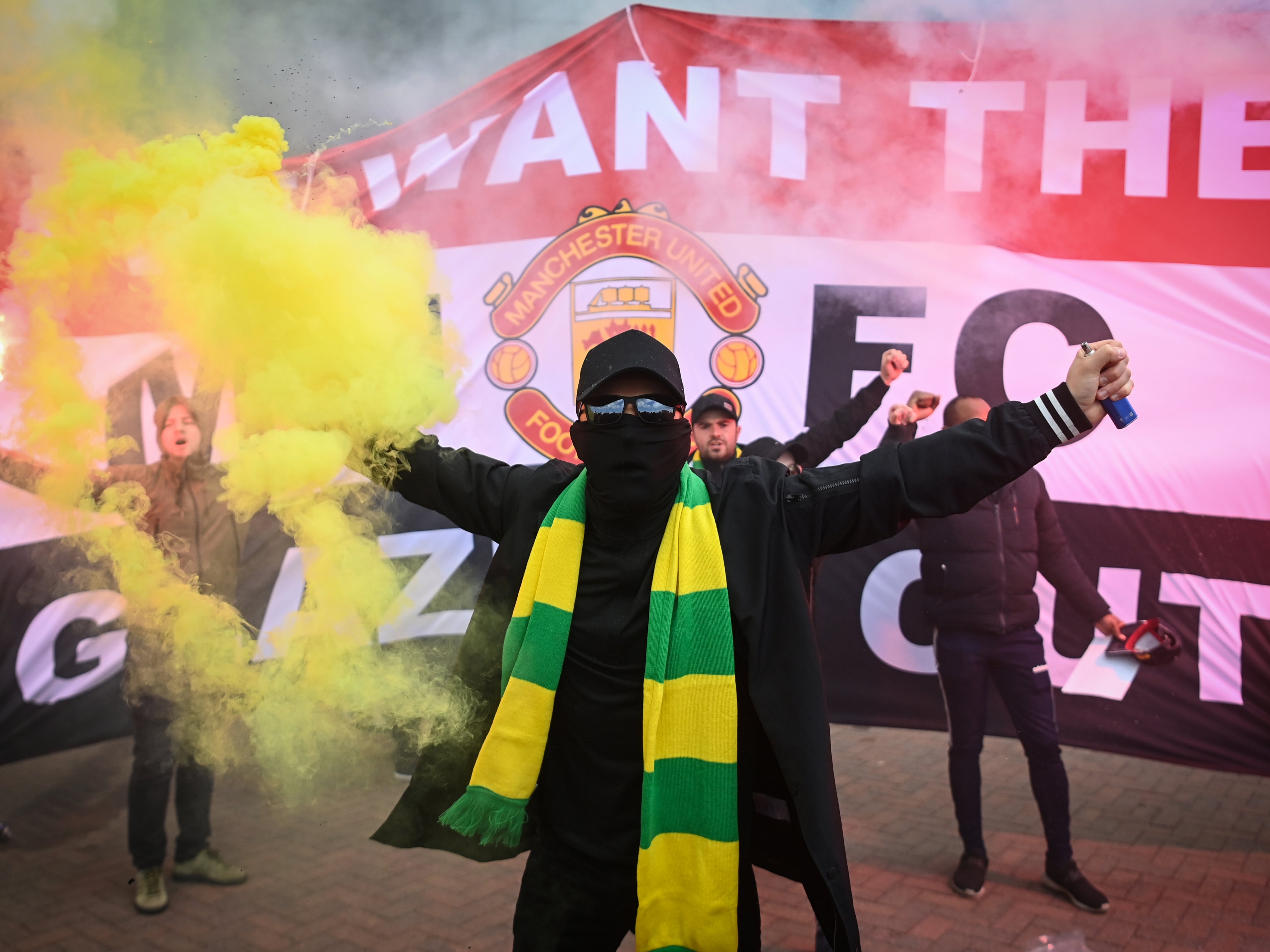 Manchester United fans protesting the Glazer family’s ownership after the Super League collapse