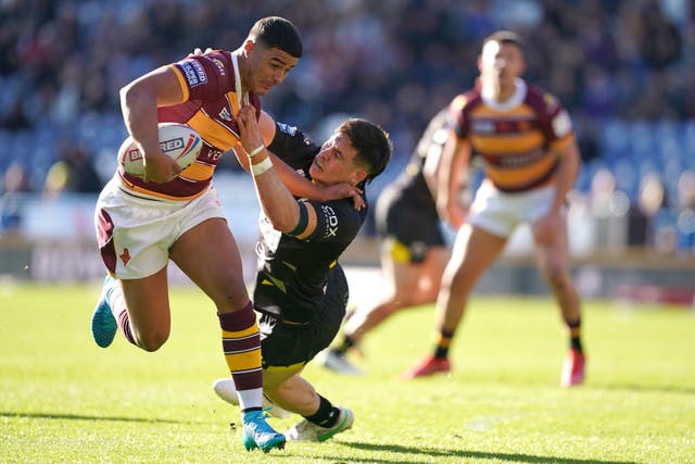 <p>Huddersfield Giants’ Will Pryce (left) in action during the match</p>