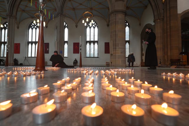 Candles are lit during the National Day of Reflection at Blackburn Cathedral, on the anniversary of the first national lockdown to prevent the spread of coronavirus. (Peter Byrne/PA)