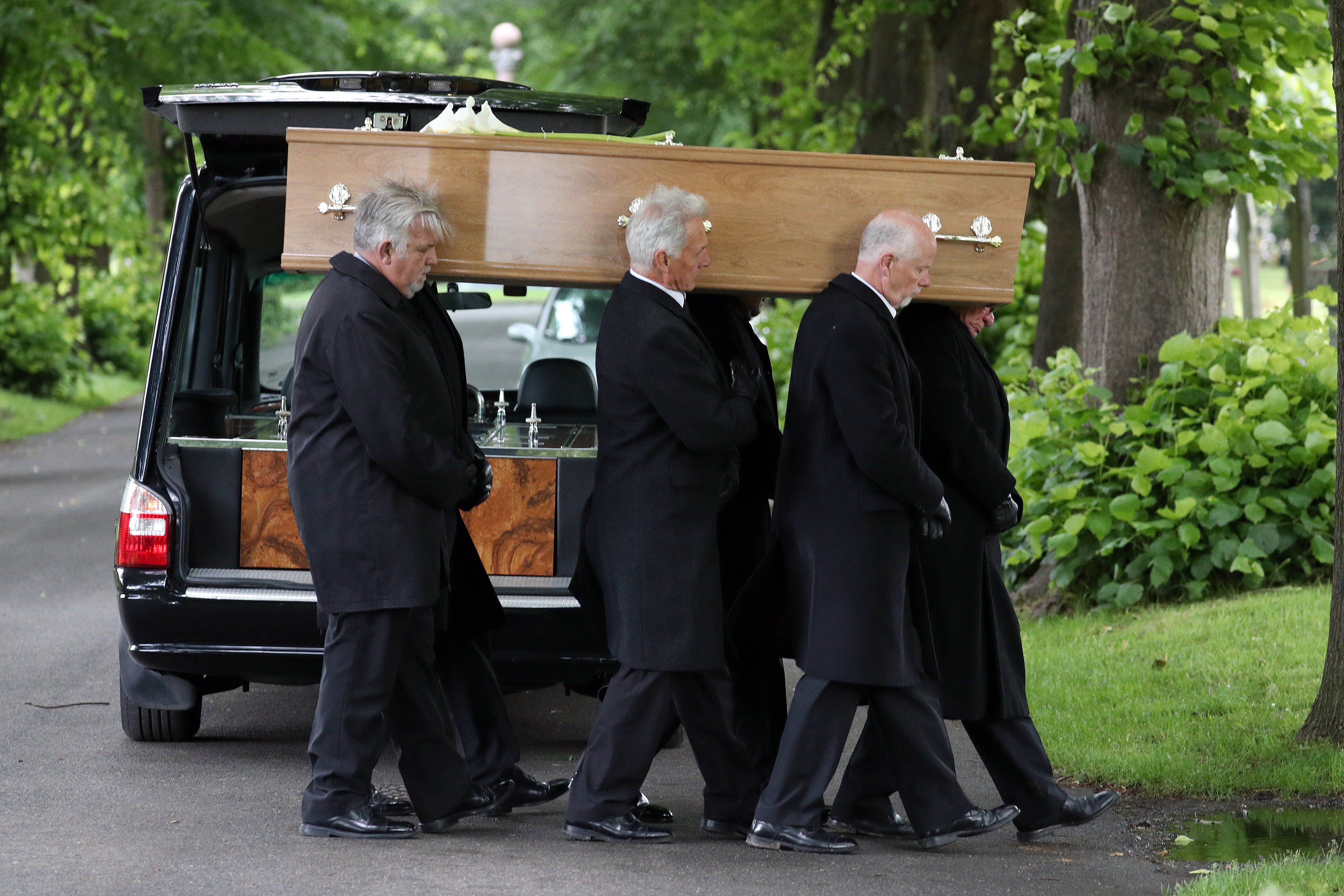 Pall-bearers carry the coffin of Jeremy Kyle guest Steve Dymond during his funeral at Kingston Cemetery in Portsmouth