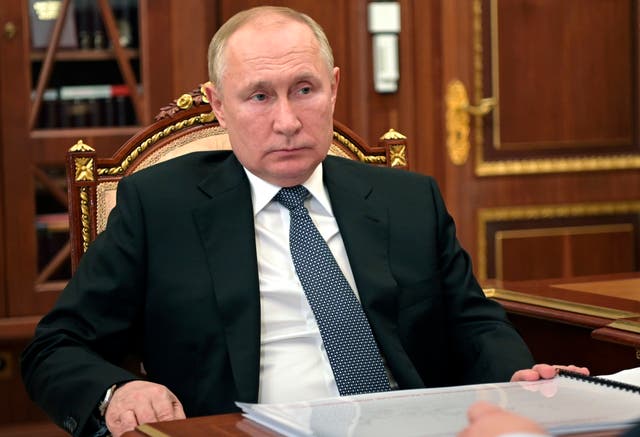 <p>Russian president Vladimir Putin listens during a meeting in Moscow, Russia</p>