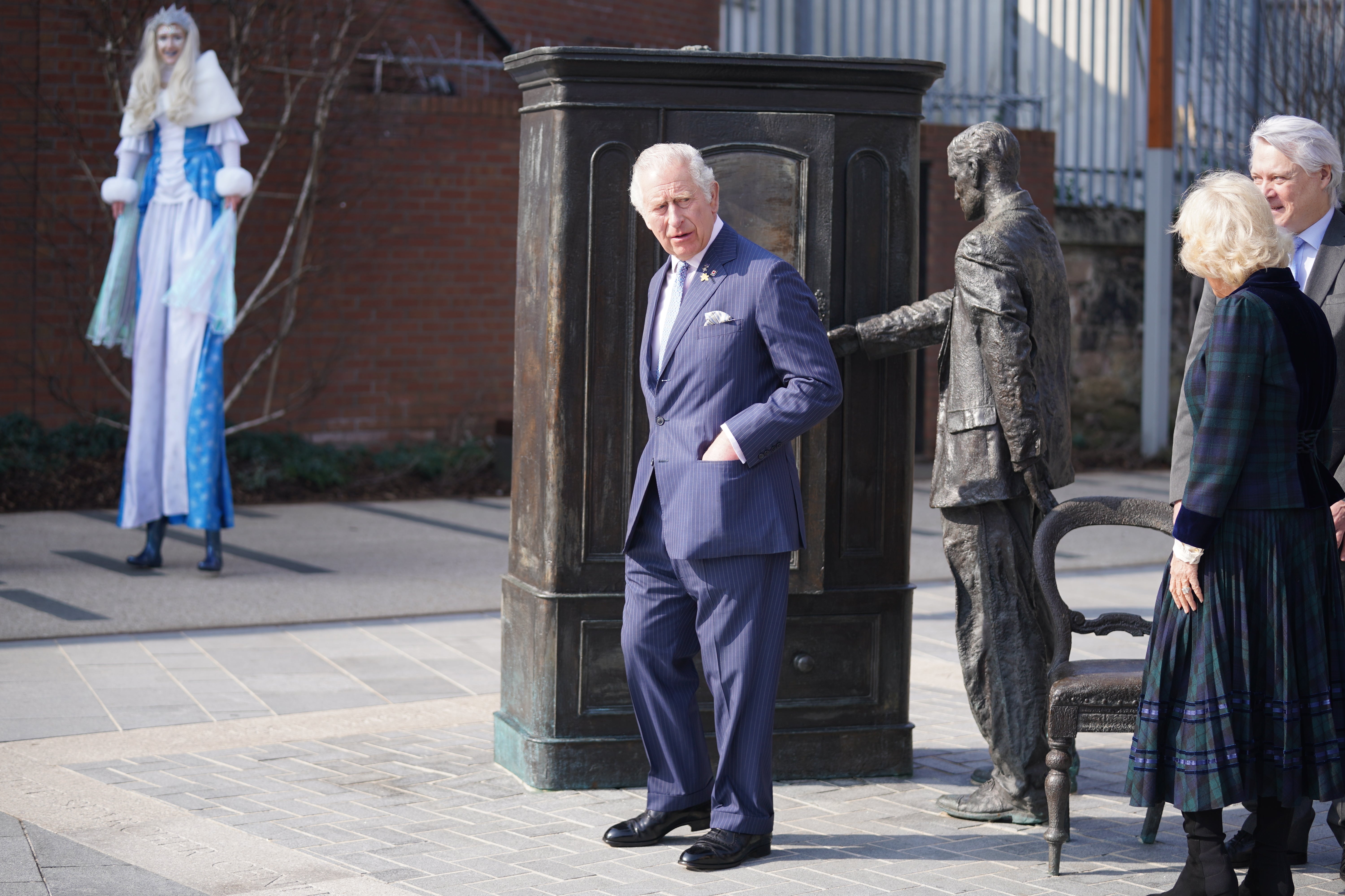 Charles and Camilla at the CS Lewis statue (Niall Carson/PA)