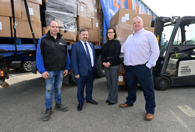 Health Minister Robin Swann with the latest consignment of humanitarian aid which is being donated to Ukraine by the Department of Health. Also pictured are, from left to right, Joe Coyle from Hope 365; Monica Turkington, BSO quality improvement and customer liaison manager; and David McCavana, BSO senior logistics manager (Department of Health/PA)