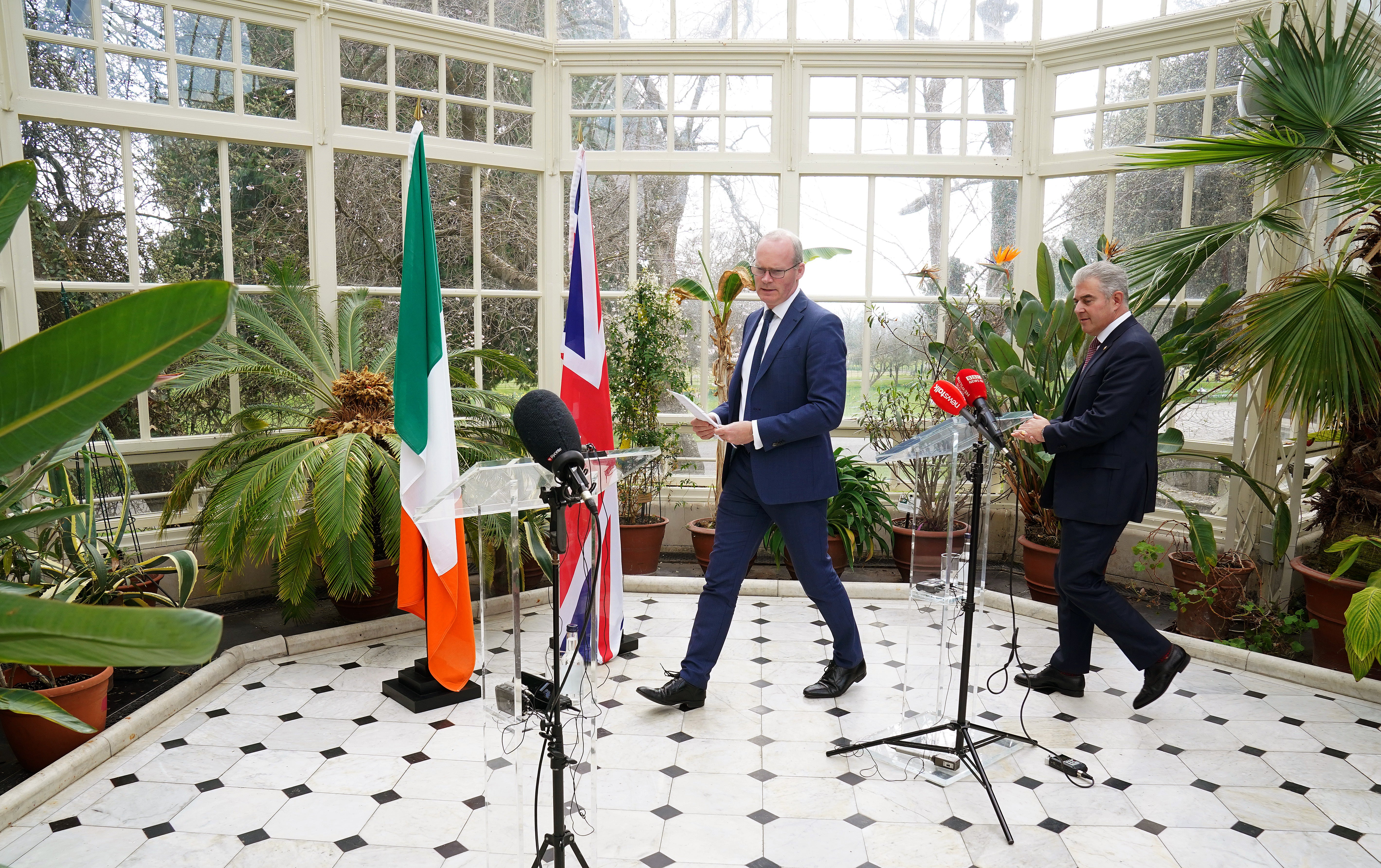 Ireland’s Foreign Affairs minister Simon Coveney (left) and Northern Ireland Secretary Brandon Lewis arrive at a press conference (Brian Lawless/PA)