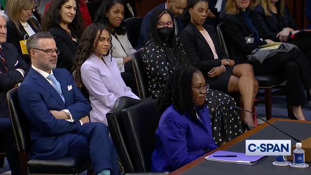 <p>Leila Jackson, daughter of Supreme Court nominee Ketanji Brown Jackson, sits behind her mother at her confirmation hearing</p>
