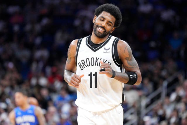 <p> Kyrie Irving #11 of the Brooklyn Nets reacts after scoring against the Orlando Magic in the second half at Amway Center on March 15, 2022 in Orlando, Florida.</p>