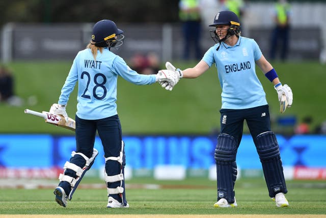 <p>England's Danni Wyatt, left, is congratulated by team captain Heather Knight after scoring a half century</p>