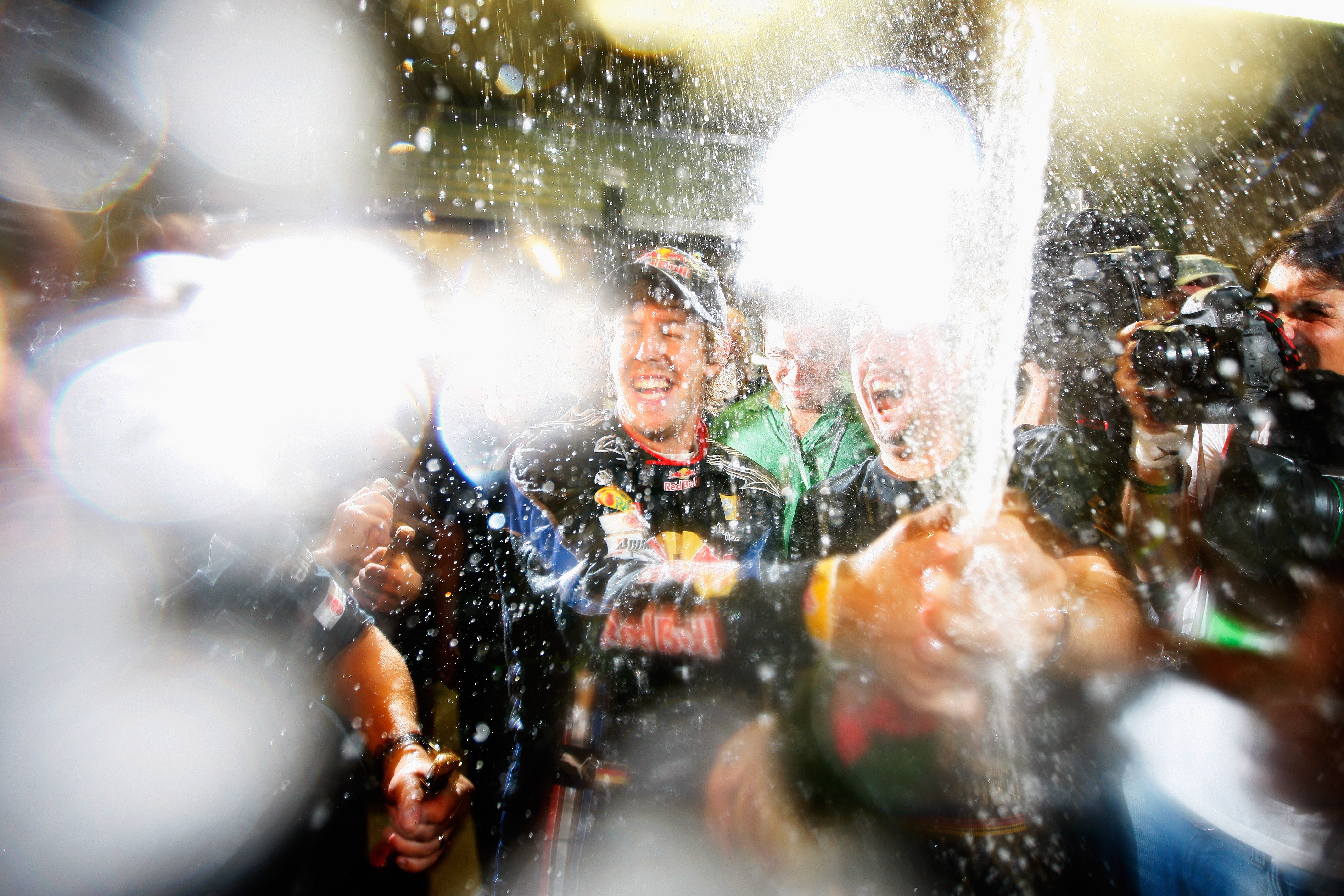 Vettel starts off the celebrations in the Red Bull garage