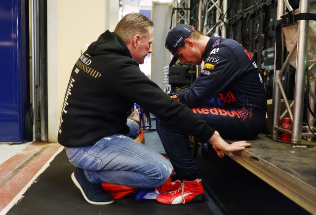 <p>Jos and Max Verstappen share a quiet moment after the drama of Abu Dhabi</p>