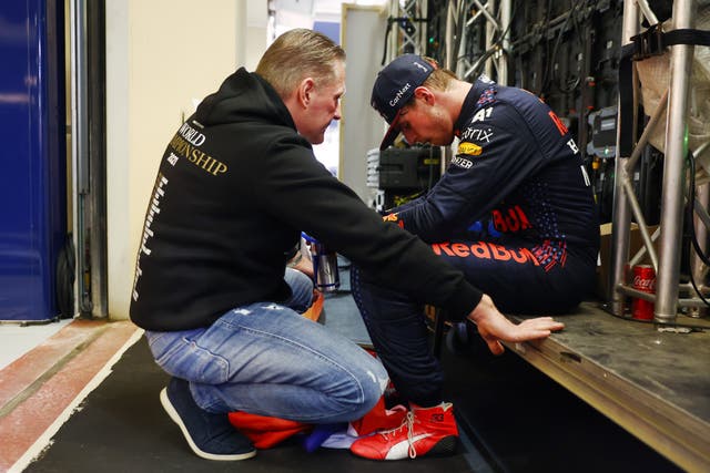 <p>Jos and Max Verstappen share a quiet moment after the drama of Abu Dhabi</p>