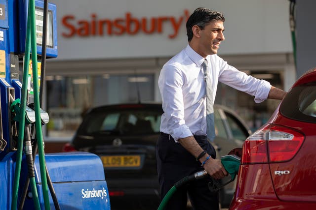 <p>Rishi Sunak refuels at a petrol station in south-east London </p>