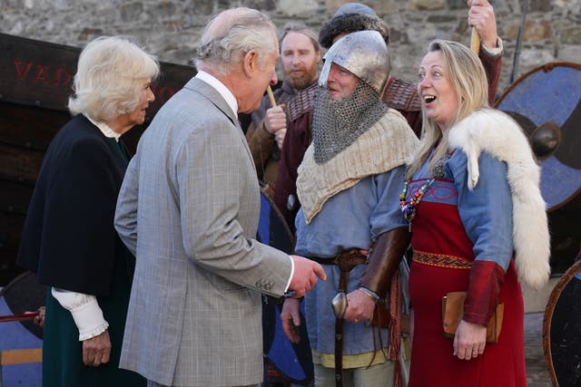 The Prince of Wales and the Duchess of Cornwall meet members of the Waterford Viking Re-enactment Group (Brian Lawless/PA)