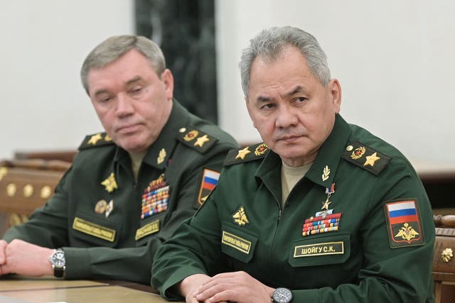 <p>Russian Defence Minister Sergei Shoigu (R) and chief of the general staff Valery Gerasimov attend a meeting with Russian President in Moscow on 27 February</p>