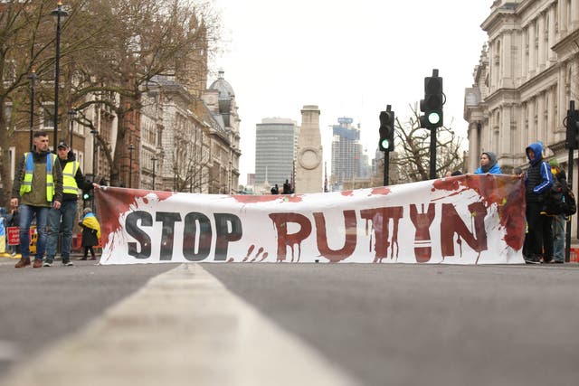 People attend a demonstration outside Downing Street, London, to show solidarity with Ukraine following the invasion by Russia (James Manning/PA)