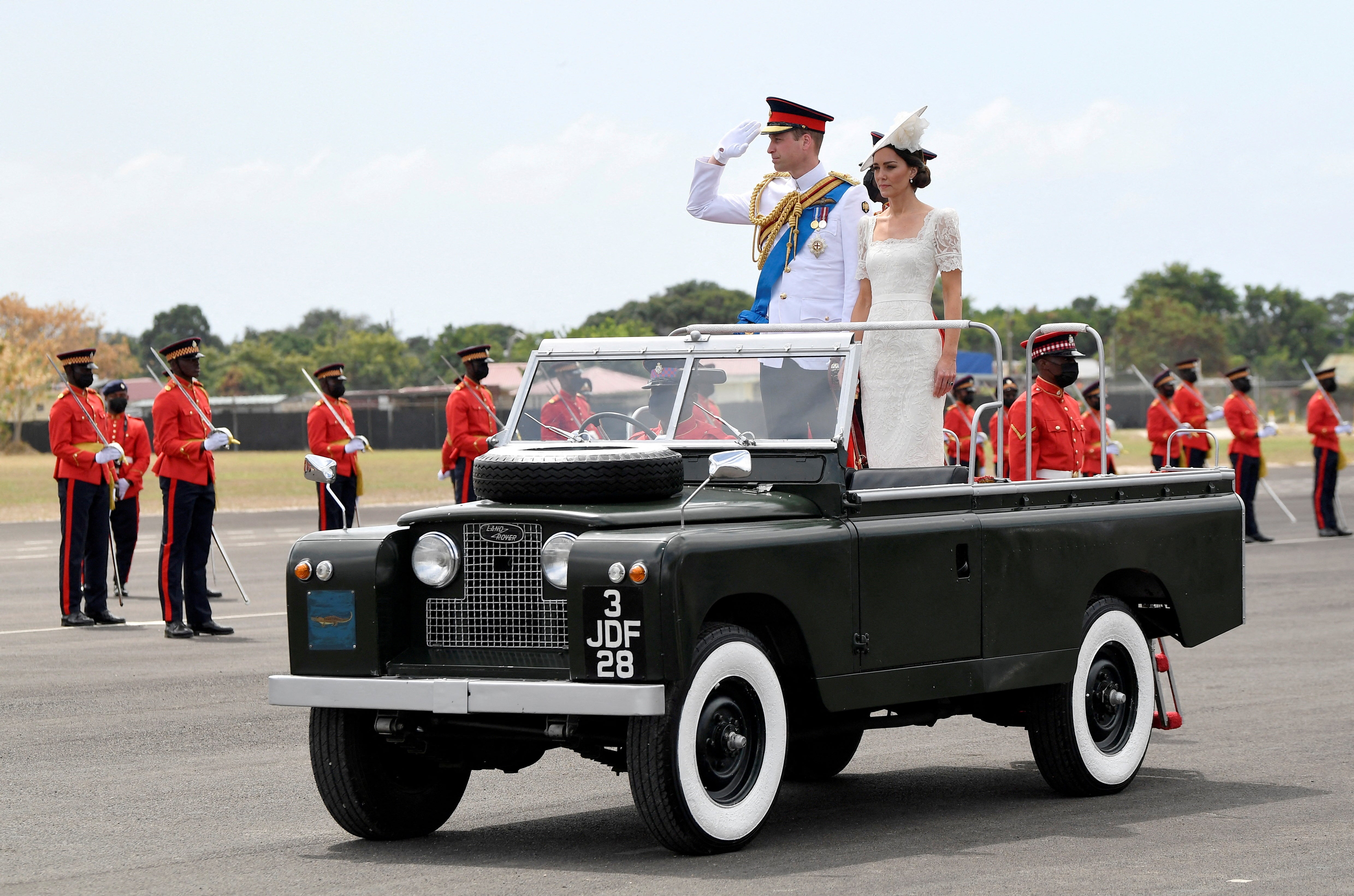 Prince William with Kate on the Queen’s ceremonial vintage Land Rover in Jamaica