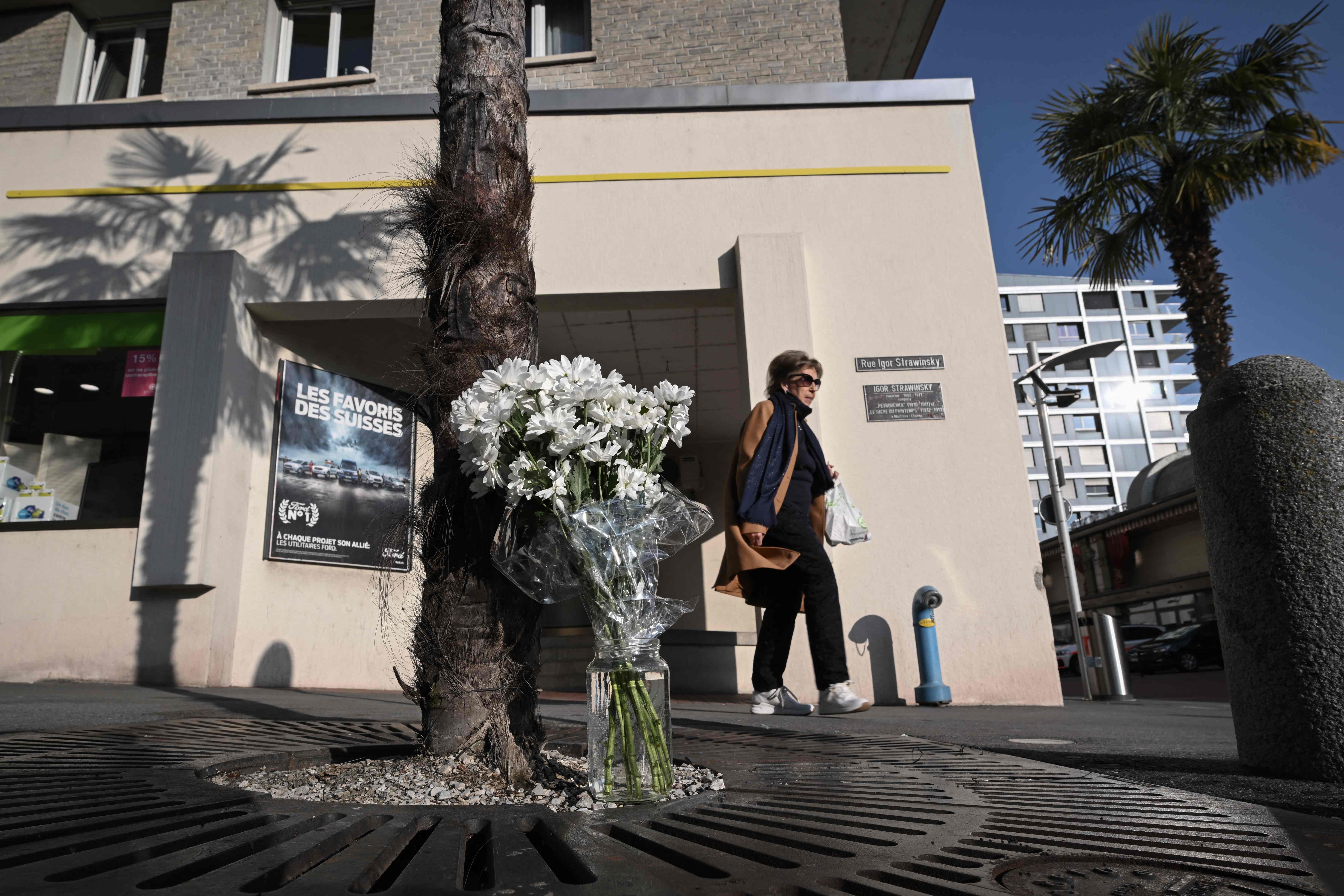 White flowers were left next to the family’s apartment building