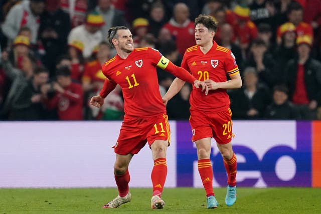 <p>Gareth Bale celebrates scoring for Wales </p>