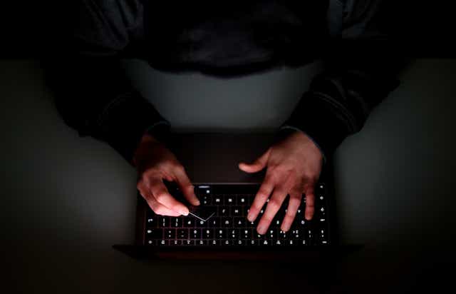 File photo of someone using a laptop. (Tim Goode/PA)