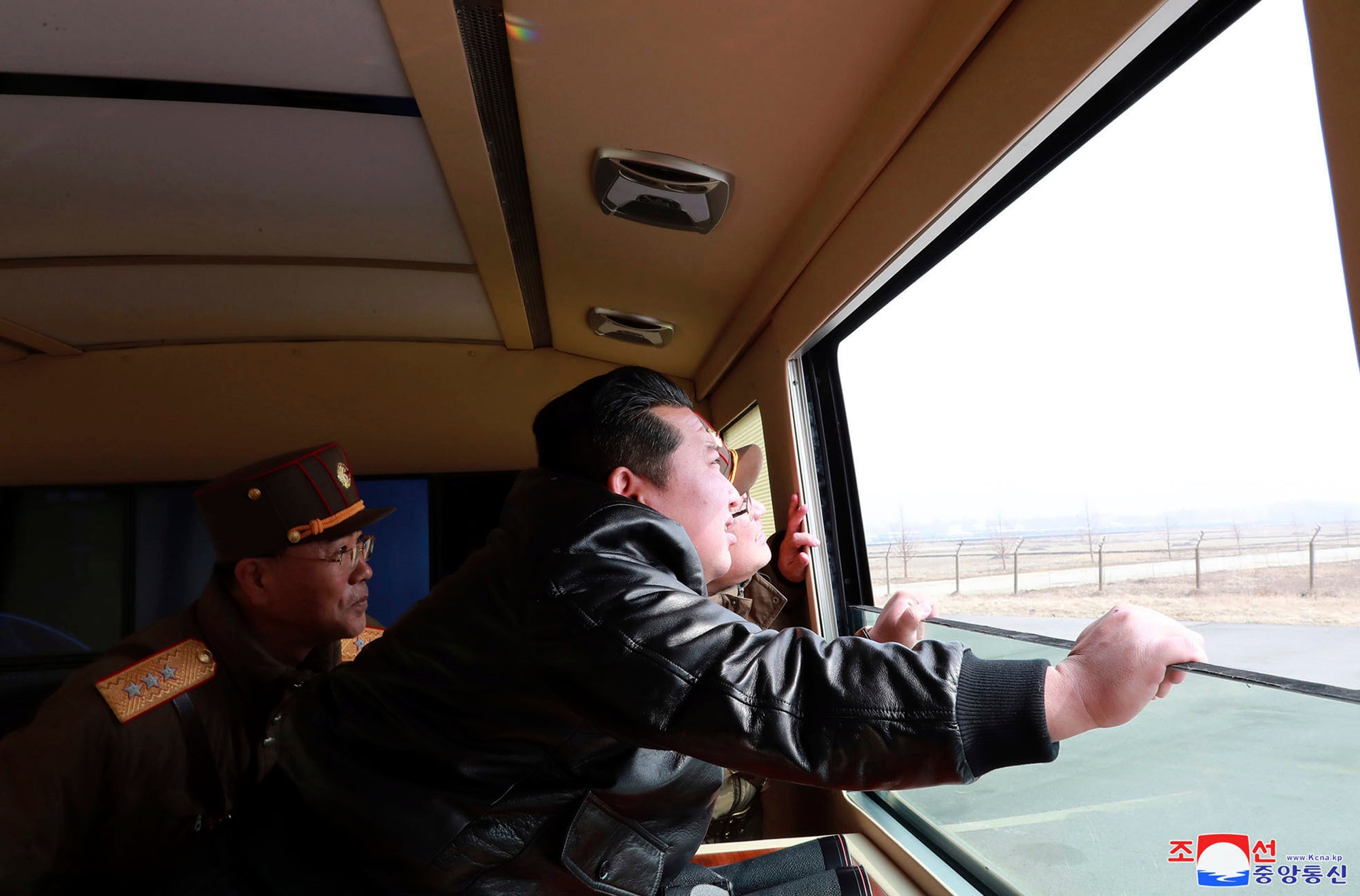 Photo distributed by the North Korean government shows Kim Jong-un watching what it says is a test-fire of a Hwasong-17 ICBM on 24 March