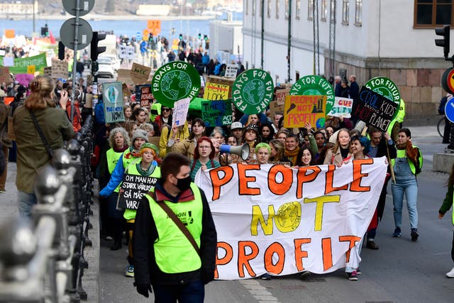 <p>Demonstrators take part in a Fridays For Future school strike for climate and social justice march through Stockholm on Friday, March 25, 2022</p>
