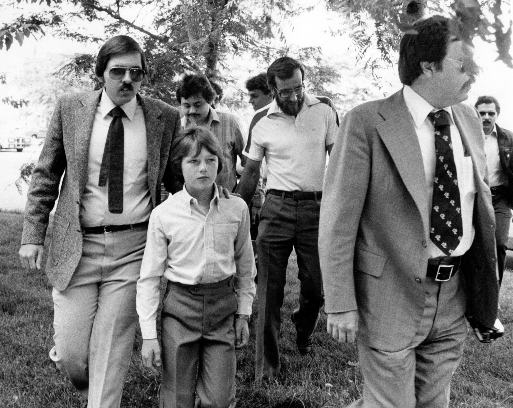 Walter Polovchak (center) walking into juvenile court for a trial about his custody on 4 August 1980