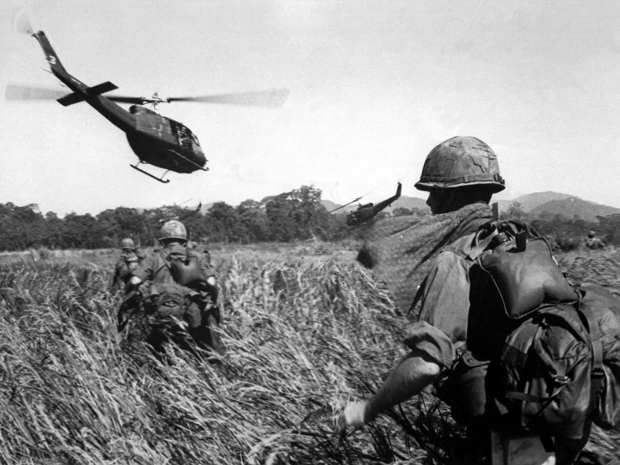 US soldiers are evacuated from a Vietcong position in December 1965