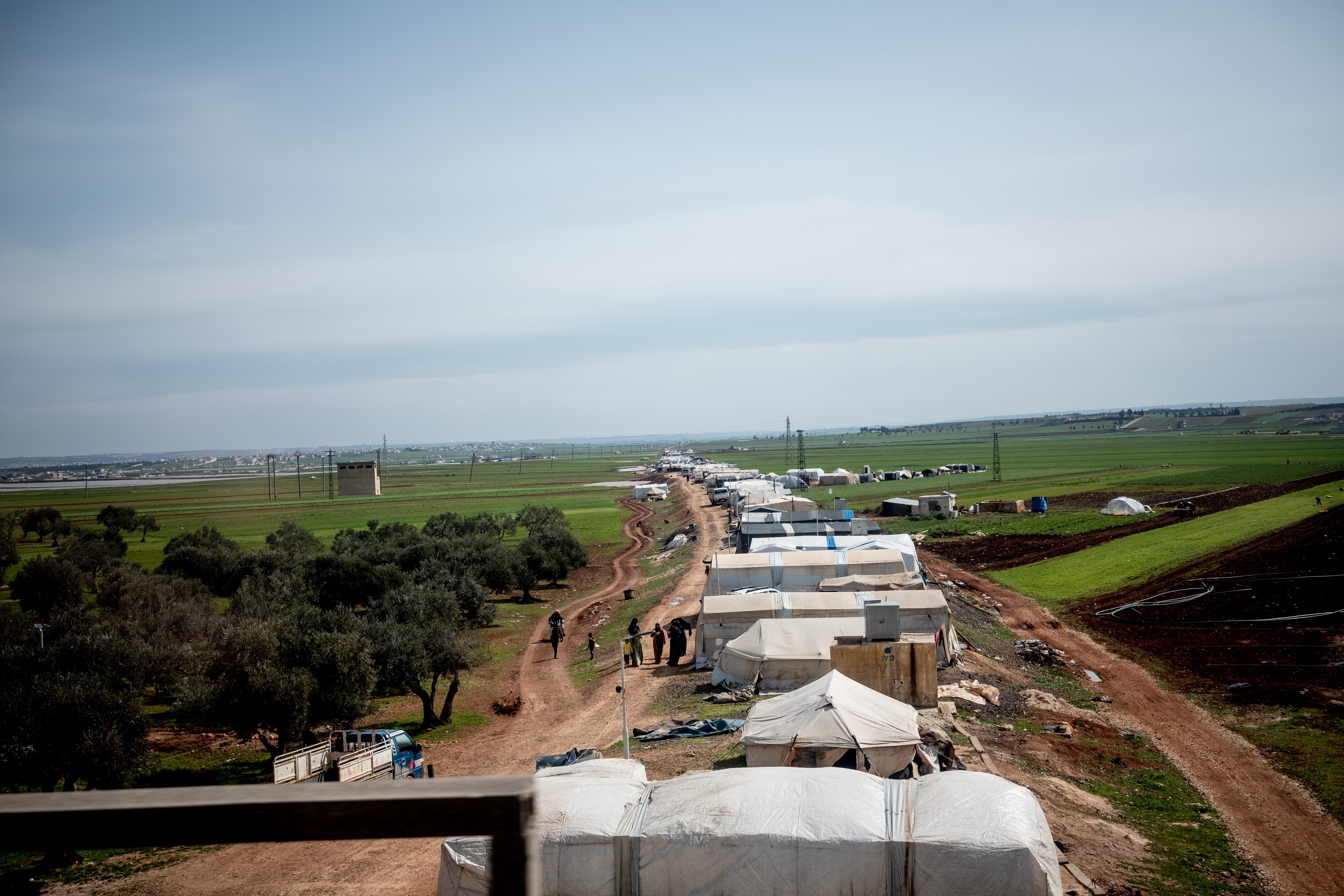 A refugee camp by the main road between the Turkish border and Idlib