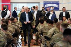 Biden eats pizza with troops in Poland and recalls how son Beau hid his name on front lines