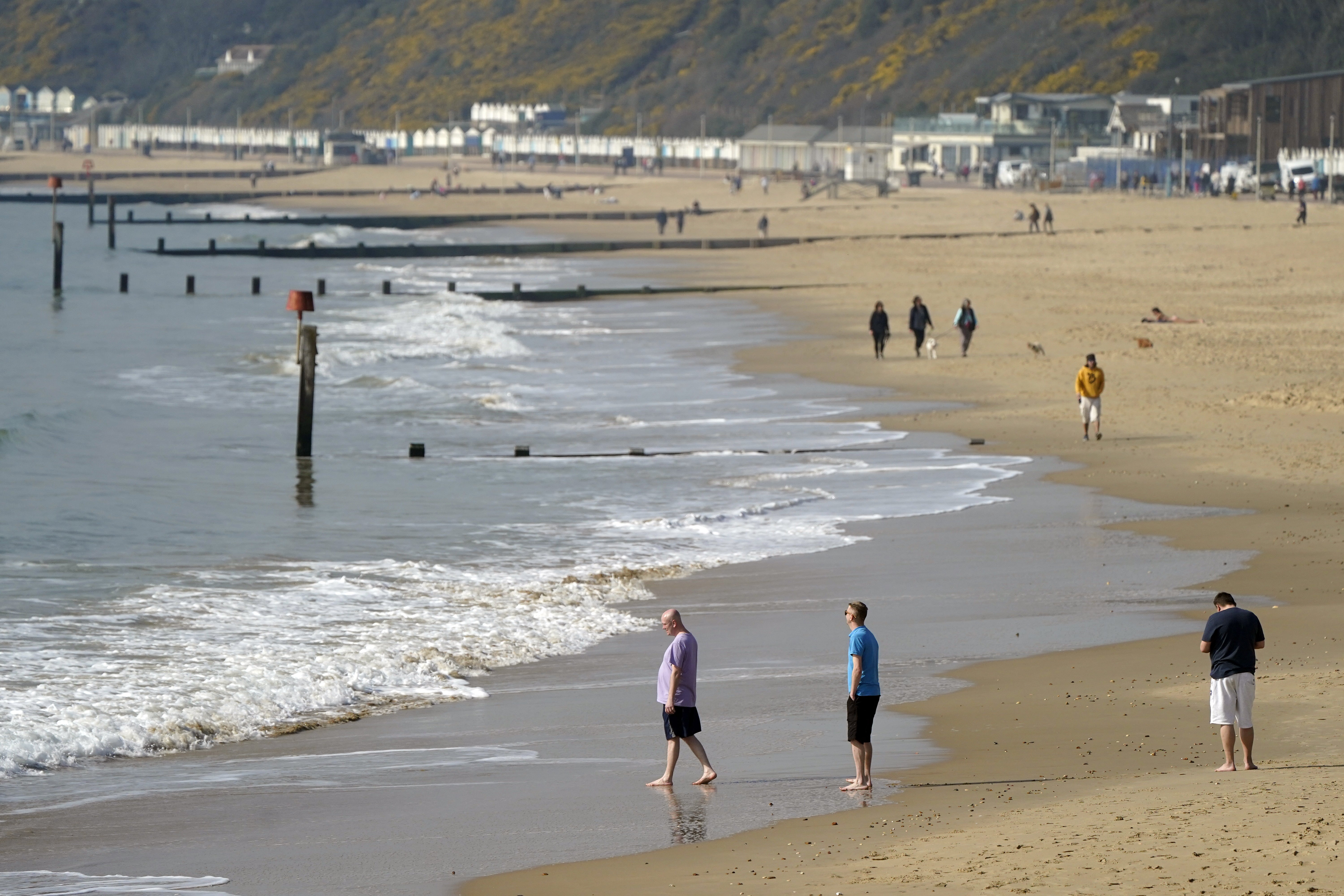 People enjoy the warm weather on Bournemouth beach, Dorset (PA)