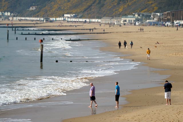 <p>People enjoy Bournemouth beach during the last spell of warmer weather in March </p>