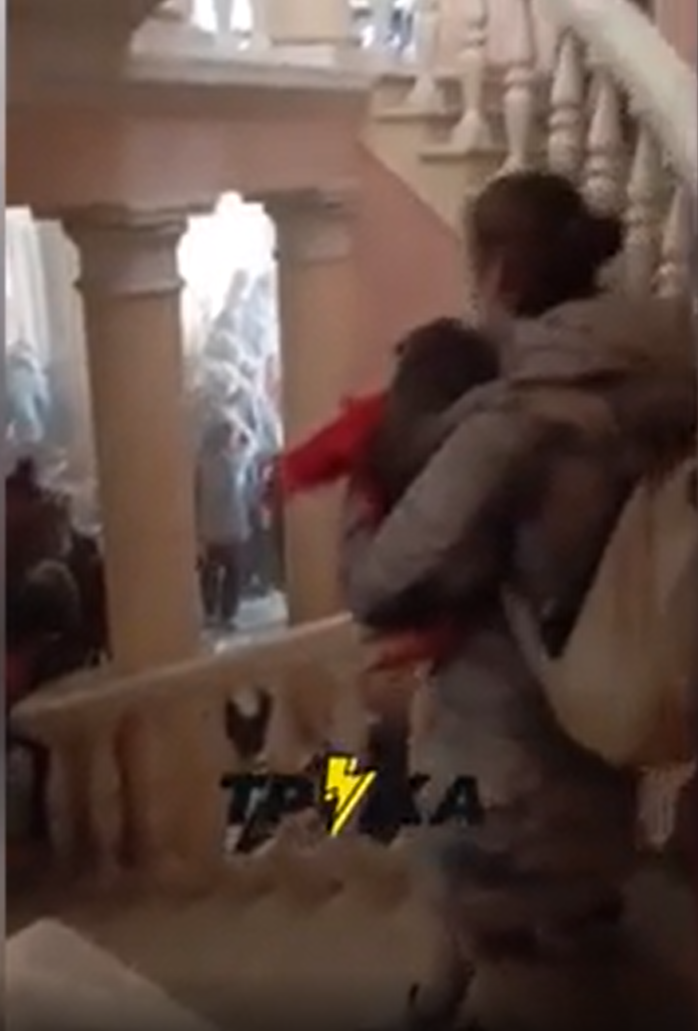 Women and small children could be seen evacuating the building