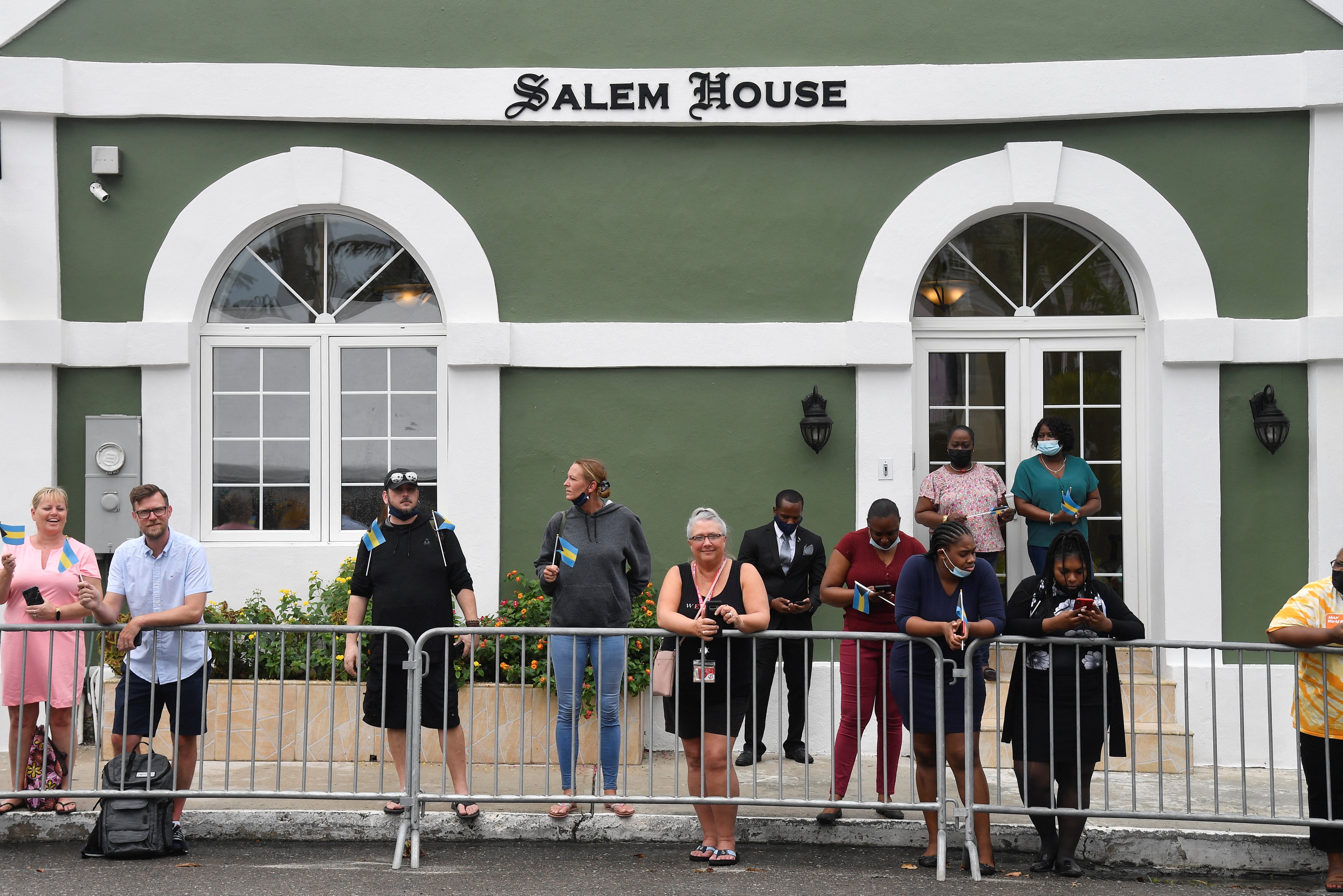 People wait to see the Duke and Duchess of Cambridge in Nassau (Toby Melville/PA)