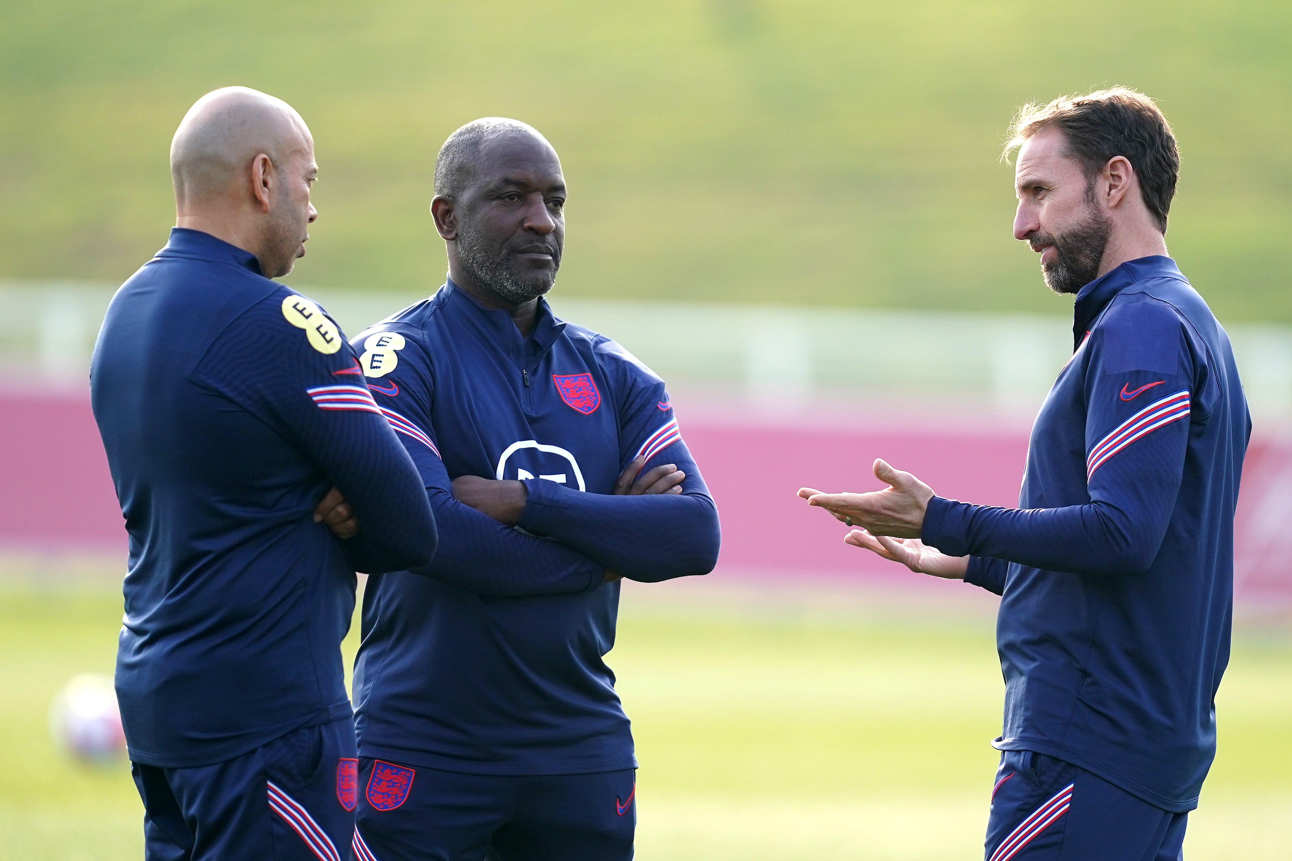 England manager Gareth Southgate (right) with first team coaches Chris Powell and Paul Nevin (left) during a training session at St George’s Park (Martin Rickett/PA)