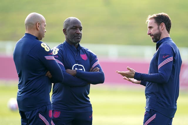 England manager Gareth Southgate (right) with first team coaches Chris Powell and Paul Nevin (left) during a training session at St George’s Park (Martin Rickett/PA)