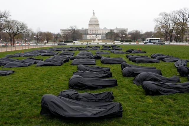 <p>March for Our Lives, the organization founded after the mass shooting at Marjory Stoneman Douglas High School in Parkland, Fla., is using body bags to spell out "Thoughts and Prayers" on the National Mall </p>