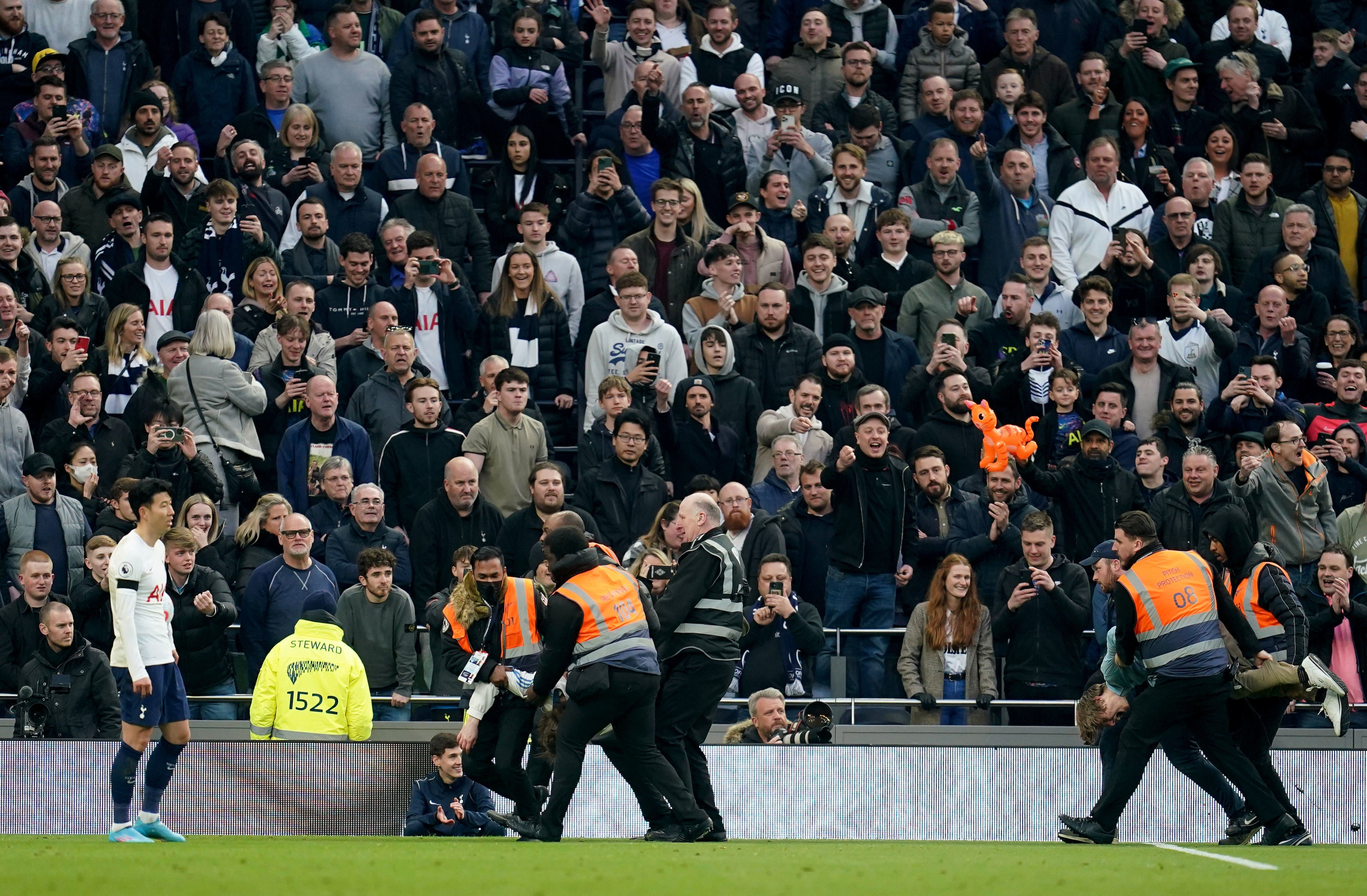 Nathan McGovern is dragged from the pitch at the Tottenham Hotspur v West Ham game in London on Sunday 20 March