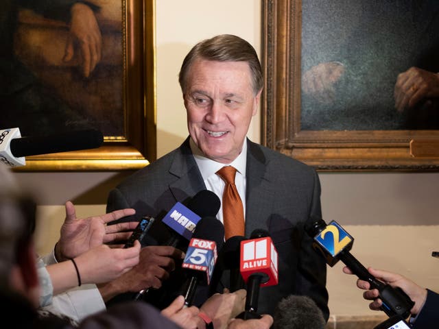 <p>Former U.S. Sen. David Perdue speaks to journalists after filing paperwork to qualify to run for governor Wednesday, March 9, 2022 at the Georgia State Capitol in Atlanta</p>