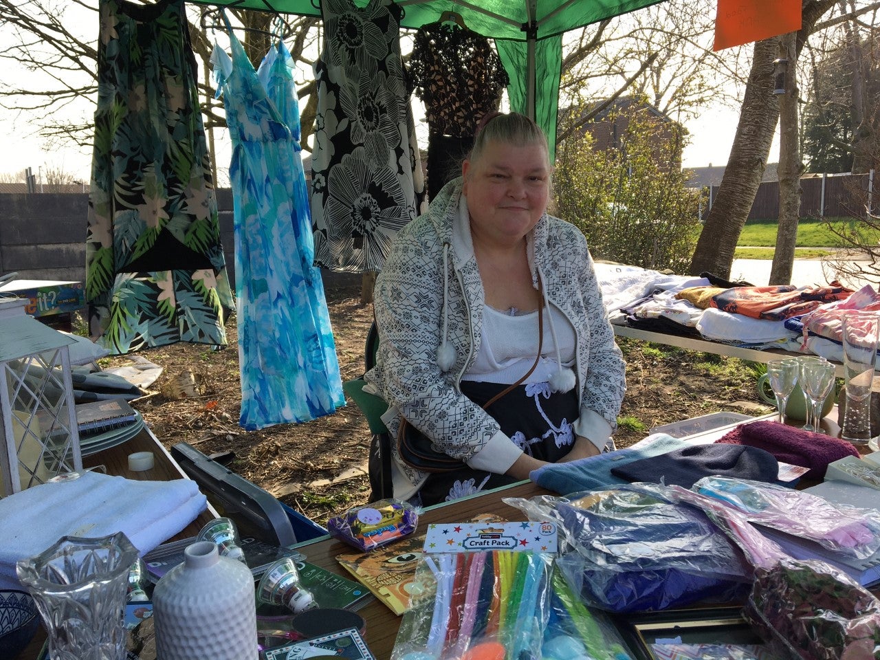 Volunteer Caroline Houlker running a fund-raising jumble stall of donated items at Trinity Foodbank