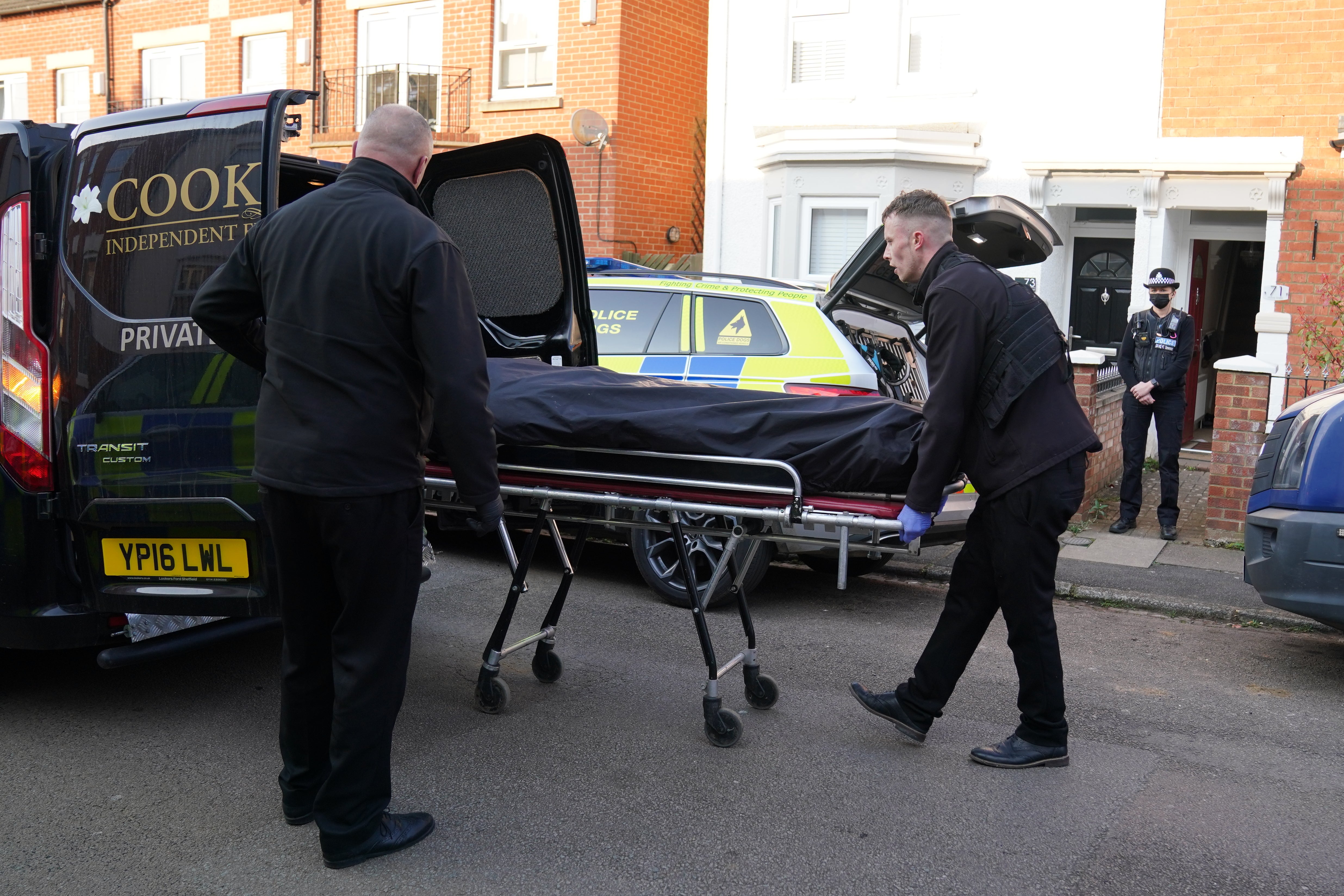 The body is removed from the property in Moore Street, Kingsley, Northampton following its discovery in the rear garden. The remains are expected be taken to Leicester where they will be forensically examined by a Home Office pathologist but are believed to be that of a missing 42-year-old male. The investigation was mounted following the arrest of Fiona Beal, 48, at a hotel in Cumbria early on Wednesday morning. She has now been charged with murder. Picture date: Sunday March 20, 2022.