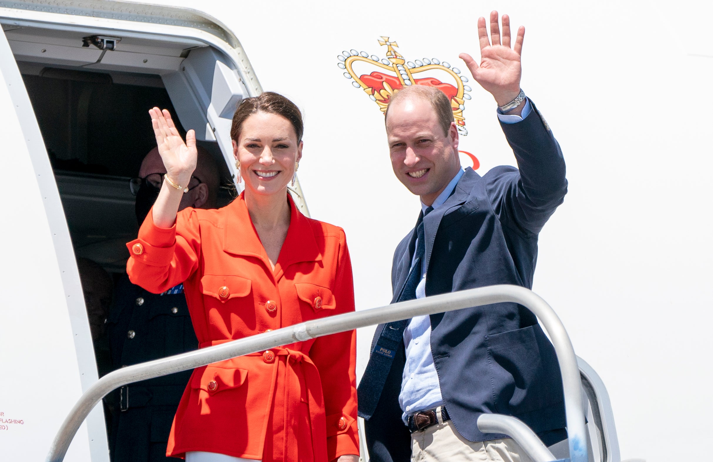 The Duke and Duchess of Cambridge board a plane as they depart Belize