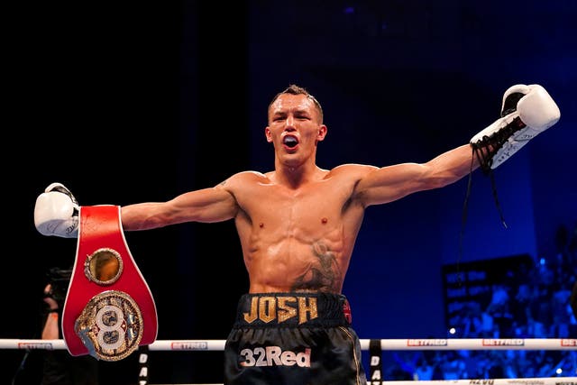 Josh Warrington celebrates after regaining the IBF featherweight to become a two-time world champion (Martin Rickett/PA)