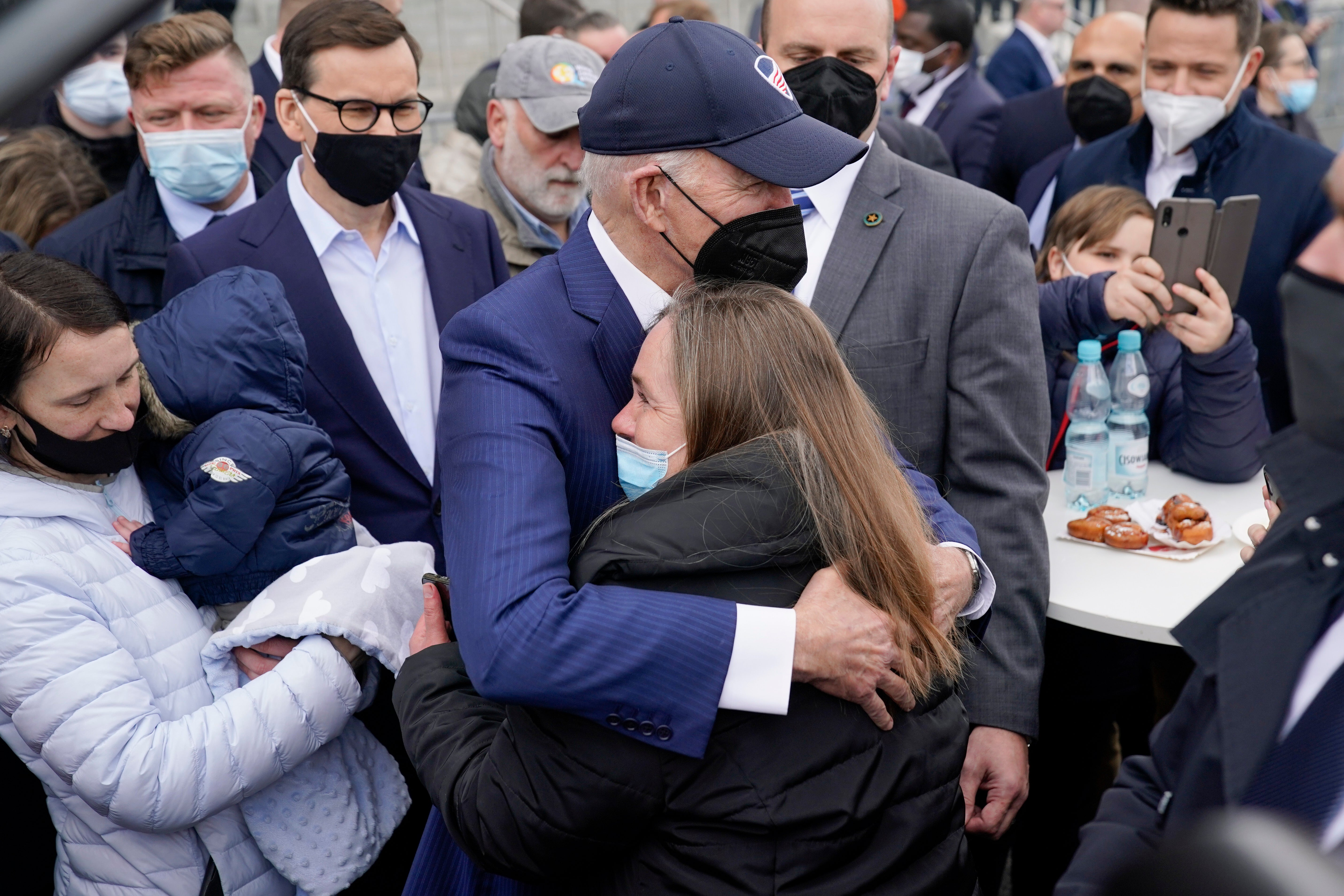 President Biden meets with Ukrainian refugees in Warsaw